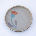 Ceramic plate with a floral design on a white background